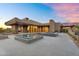 Contemporary desert home featuring a pool, fire feature, and spacious patio at 10354 E Celestial Dr, Scottsdale, AZ 85262