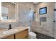Modern bathroom featuring marble-look walls, walk-in shower, updated fixtures, and sleek vanity at 10354 E Celestial Dr, Scottsdale, AZ 85262