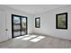Bright bedroom with natural light from large sliding door, complemented by two smaller windows at 10354 E Celestial Dr, Scottsdale, AZ 85262