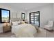 Bright bedroom with modern design elements and access to a serene outdoor space at 10354 E Celestial Dr, Scottsdale, AZ 85262