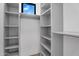Walk-in closet with bright built-in shelving, offering efficient and organized storage at 10354 E Celestial Dr, Scottsdale, AZ 85262