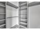 Walk-in closet with ample shelving, providing generous storage space at 10354 E Celestial Dr, Scottsdale, AZ 85262