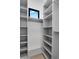Spacious walk-in closet with shelving and hanging rods for ample storage and organization at 10354 E Celestial Dr, Scottsdale, AZ 85262