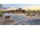 Contemporary home with desert landscaping, brick driveway, and modern design at 10354 E Celestial Dr, Scottsdale, AZ 85262