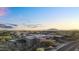 Desert home with spacious multi-level patios, desert landscaping, and mountain views at 10354 E Celestial Dr, Scottsdale, AZ 85262
