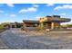 Stunning desert home showcasing modern architecture and meticulous landscape design with paver driveway at 10354 E Celestial Dr, Scottsdale, AZ 85262