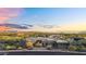 Beautiful desert home and yard with neutral colors, mountain views and desert landscaping at 10354 E Celestial Dr, Scottsdale, AZ 85262
