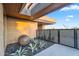 Landscaped front yard with rock features, agave plants, and covered entry at 10354 E Celestial Dr, Scottsdale, AZ 85262