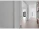 Bright hallway with clean lines and neutral palette, leading to various rooms, showcasing modern design at 10354 E Celestial Dr, Scottsdale, AZ 85262
