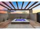 A modern hot tub is surrounded by decorative rock and landscaping, providing a serene retreat at 10354 E Celestial Dr, Scottsdale, AZ 85262