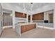Gourmet kitchen featuring large island, custom cabinetry, and pendant lighting, perfect for culinary enthusiasts at 10354 E Celestial Dr, Scottsdale, AZ 85262