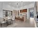 Modern kitchen features an island with bar seating and pendant lighting at 10354 E Celestial Dr, Scottsdale, AZ 85262