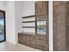 Custom cabinets offer a wine fridge, shelving, and storage options in this well-appointed kitchen at 10354 E Celestial Dr, Scottsdale, AZ 85262