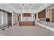 Open-concept kitchen with modern appliances, a large island, and custom cabinets for ample storage at 10354 E Celestial Dr, Scottsdale, AZ 85262