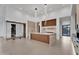Bright, open kitchen featuring a central island, pendant lights, and modern appliances for seamless cooking at 10354 E Celestial Dr, Scottsdale, AZ 85262