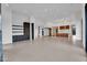 Spacious living room with open layout, featuring recessed lighting and access to kitchen and hall at 10354 E Celestial Dr, Scottsdale, AZ 85262