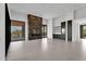 Spacious living room with modern floors, a decorative fireplace, and ample natural light at 10354 E Celestial Dr, Scottsdale, AZ 85262