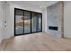 Modern living room features sleek fireplace and seamless indoor-outdoor living at 10354 E Celestial Dr, Scottsdale, AZ 85262