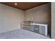 Outdoor kitchen featuring stainless steel grill, sink, and refrigerator for easy entertaining at 10354 E Celestial Dr, Scottsdale, AZ 85262