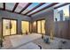 A spacious patio with modern doors showcases sleek design and desert landscaping at 10354 E Celestial Dr, Scottsdale, AZ 85262