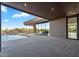 An expansive backyard patio with a pool, outdoor seating, and a view of the desert landscape at 10354 E Celestial Dr, Scottsdale, AZ 85262