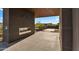 Back patio with an outdoor fireplace and tiled floor provides a serene space for relaxation and entertaining at 10354 E Celestial Dr, Scottsdale, AZ 85262