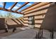 Covered patio area with modern stucco and desert landscaping at 10354 E Celestial Dr, Scottsdale, AZ 85262