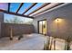 An inviting patio features minimalist desert landscaping and seamless indoor-outdoor flow at 10354 E Celestial Dr, Scottsdale, AZ 85262