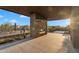 Covered patio with built-in fireplace, offering an inviting outdoor space for relaxation and entertaining at 10354 E Celestial Dr, Scottsdale, AZ 85262