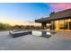 Relax and unwind in this modern backyard oasis with a pool, spa, and desert landscape at 10354 E Celestial Dr, Scottsdale, AZ 85262