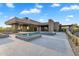A sleek pool with a spa, fire feature, and xeriscaped landscaping at 10354 E Celestial Dr, Scottsdale, AZ 85262
