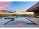 The backyard boasts a stylish pool, spa, and desert views, ideal for luxurious outdoor living at 10354 E Celestial Dr, Scottsdale, AZ 85262