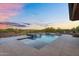 A modern pool with an integrated hot tub and desert views is perfect for outdoor relaxation at 10354 E Celestial Dr, Scottsdale, AZ 85262