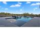 Modern pool featuring a spa and desert views under a bright sky at 10354 E Celestial Dr, Scottsdale, AZ 85262
