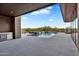 Beautiful pool area featuring a luxurious in-ground pool, modern tiles, and an outdoor kitchen/bar area at 10354 E Celestial Dr, Scottsdale, AZ 85262