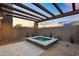 Private spa and outdoor shower area surrounded by desert landscaping at 10354 E Celestial Dr, Scottsdale, AZ 85262