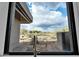 Scenic view from the kitchen window showcases the desert landscape with native plants and clear blue skies at 10354 E Celestial Dr, Scottsdale, AZ 85262