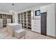 Spacious walk-in closet offers ample storage, open shelving, and sleek, modern design at 10354 E Celestial Dr, Scottsdale, AZ 85262