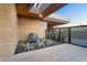 Stylish outdoor area showcases a boulder water feature surrounded by desert landscaping and a metal fence at 10354 E Celestial Dr, Scottsdale, AZ 85262