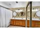 Bright bathroom with double vanity, wood cabinets, and a large mirror reflecting the spacious interior at 10778 W Via Del Sol --, Peoria, AZ 85373