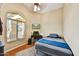 Cozy bedroom with a large window, ceiling fan, and bed with blue accents at 10778 W Via Del Sol --, Peoria, AZ 85373