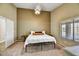 Cozy bedroom with a comfortable bed, neutral paint, and large window for natural light at 10778 W Via Del Sol --, Peoria, AZ 85373
