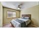 Serene bedroom featuring a wood-frame bed and ample natural light from the window at 10778 W Via Del Sol --, Peoria, AZ 85373