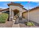 Inviting home entrance with desert landscaping and a charming covered porch area at 10778 W Via Del Sol --, Peoria, AZ 85373