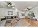 Bright living room with a comfortable gray sofa, stylish decor, and wood-look flooring at 10778 W Via Del Sol --, Peoria, AZ 85373
