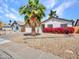 Charming single-story home with a well-maintained front yard and beautiful desert landscaping at 108 W Ivyglen St, Mesa, AZ 85201