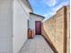 Exterior door with tiled walkway and block wall at 108 W Ivyglen St, Mesa, AZ 85201