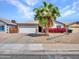A charming home with lush landscaping and a two-car garage at 108 W Ivyglen St, Mesa, AZ 85201