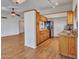 Open kitchen with stainless steel appliances, wood cabinets, and granite countertops at 108 W Ivyglen St, Mesa, AZ 85201