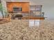 Granite countertops highlight this kitchen with stainless steel appliances and updated backsplash at 108 W Ivyglen St, Mesa, AZ 85201